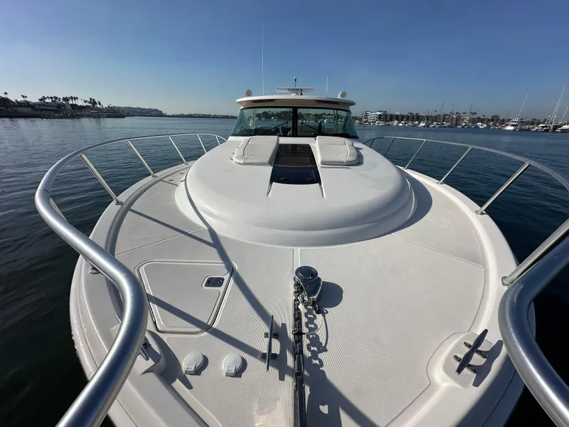 Slide: The Image of 2013 Tiara Yachts 3900 Open on calm water, showcasing sleek deck design. - 45