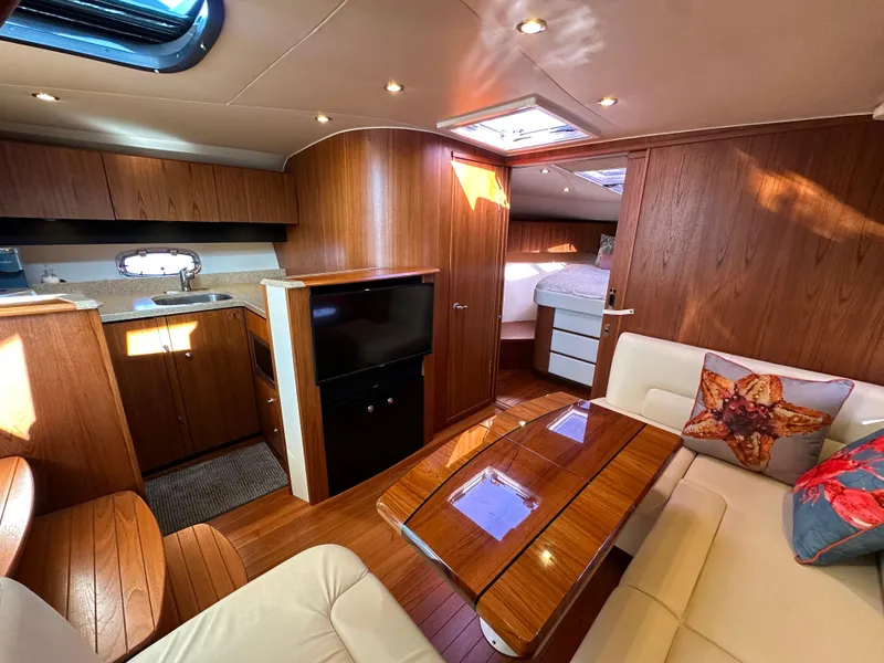Slide: The Image of Luxurious interior of 2013 Tiara Yachts 3900 Open, featuring wood finishes and cozy seating. - 48