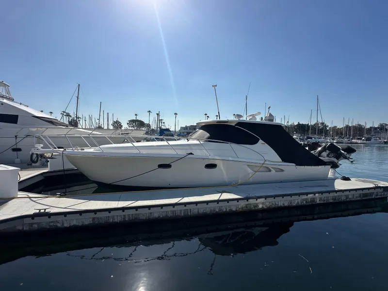 Slide: The Image of 2013 Tiara Yachts 3900 Open docked in a sunny marina. - 8