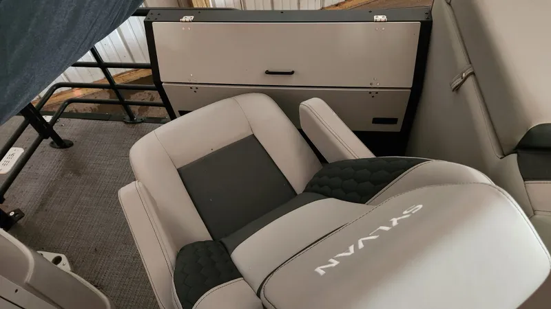 Slide: The Image of Interior of a 2026 Sylvan L3 with gray upholstery and black accents. - 27