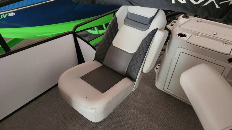Slide: The Image of Seating area of a 2026 Sylvan L3 boat with gray and white upholstery. - 18