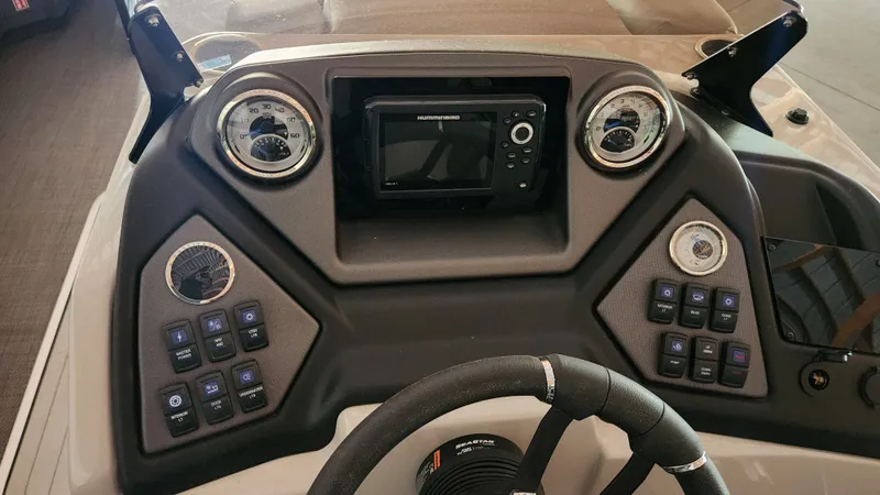 Slide: The Image of The image shows the dashboard of a 2026 Sylvan L3 boat with modern instruments. - 21