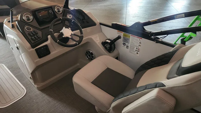 Slide: The Image of Interior view of a 2026 Sylvan L3 with a modern helm and comfortable seating. - 19