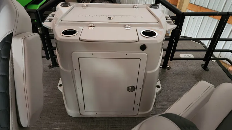 Slide: The Image of The image shows the cockpit of a 2026 Sylvan L3 boat with a central console. - 25