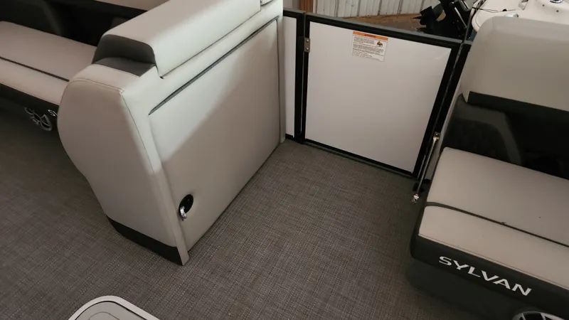 Slide: The Image of Interior of a Sylvan L3 pontoon boat with gray upholstery and flooring. - 13