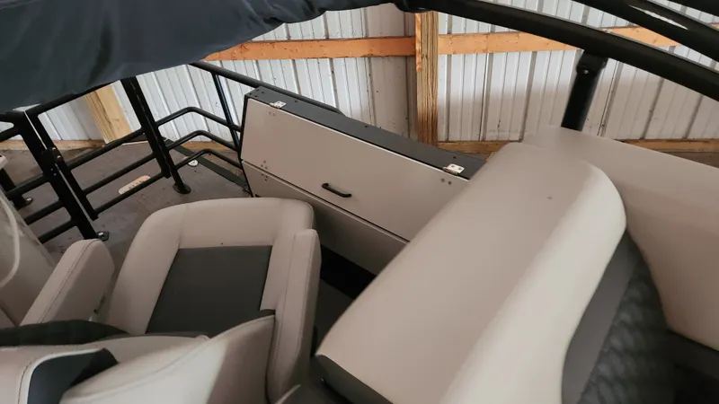 Slide: The Image of Interior of a 2026 Sylvan L3 with gray and black seating. - 17