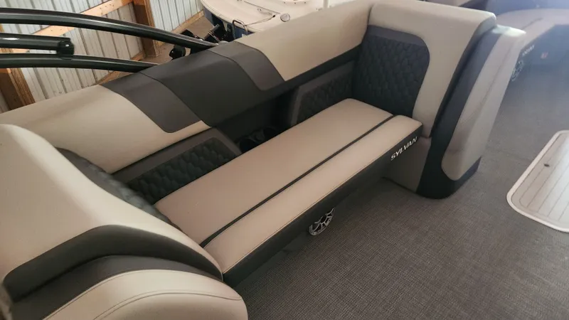 Slide: The Image of Interior of a 2026 Sylvan L3 with sleek, upholstered seating in beige and black. - 29