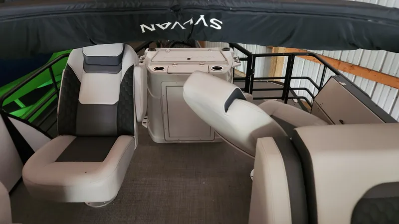 Slide: The Image of Interior of a 2026 Sylvan L3 with gray and black seating. - 16
