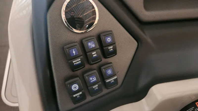 Slide: The Image of Control panel of a Sylvan L3 boat with various switches and indicator lights. - 22