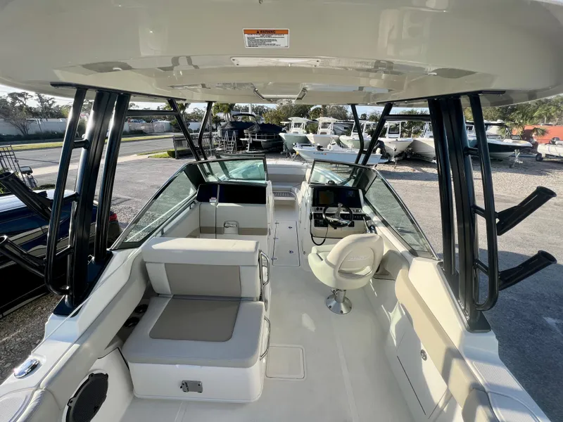 Slide: The Image of 2025 Boston Whaler 240 Vantage boat interior with seating and helm. - 10