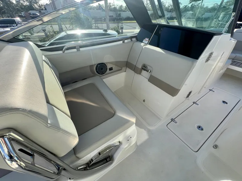 Slide: The Image of 2025 Boston Whaler 240 Vantage interior with seating and storage features. - 11