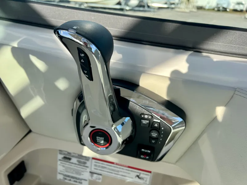 Slide: The Image of Throttle control of 2025 Boston Whaler 240 Vantage boat, featuring modern design and functionality. - 14