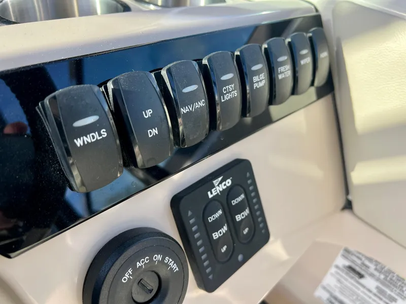 Slide: The Image of Control panel of 2025 Boston Whaler 240 Vantage boat with labeled switches. - 16