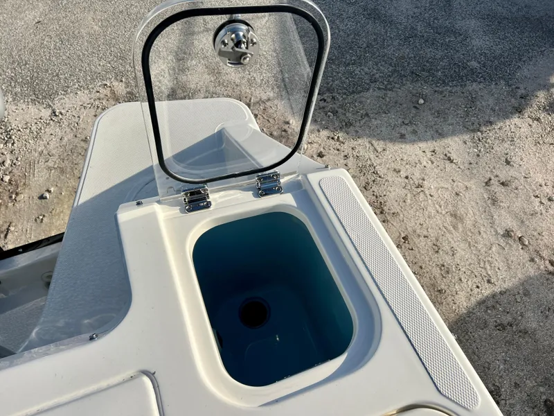 Slide: The Image of Open storage compartment on 2025 Boston Whaler 240 Vantage boat. - 24