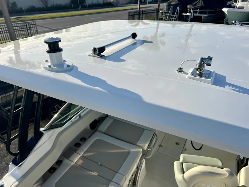 Slide: The Image of 2025 Boston Whaler 240 Vantage boat roof and seating area, showcasing modern design. - 33