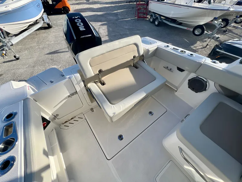 Slide: The Image of 2025 Boston Whaler 240 Vantage boat interior with seating and motor. - 9