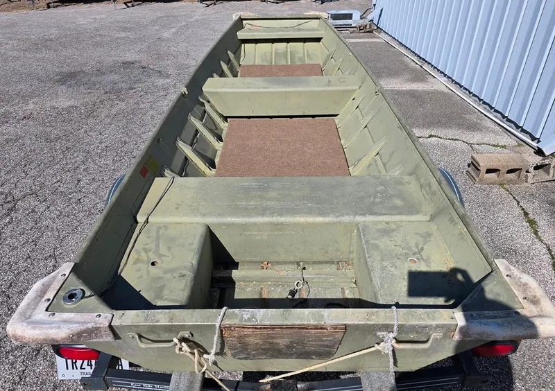 Slide: The Image of 1996 Sea Nymph Sport 1436 Jon boat, green, parked on concrete surface. - 2