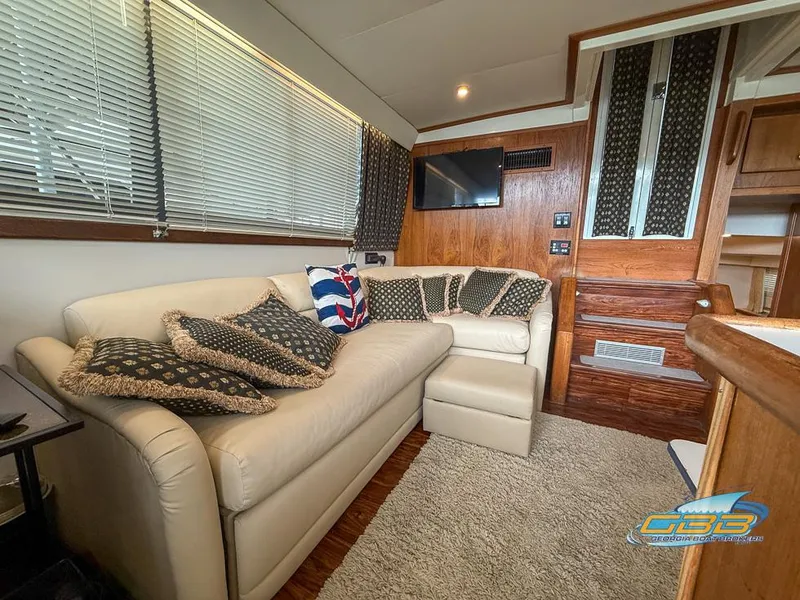 Slide: The Image of Interior of 1995 Carver 430 Cockpit Motor Yacht with cozy seating and modern decor. - 2