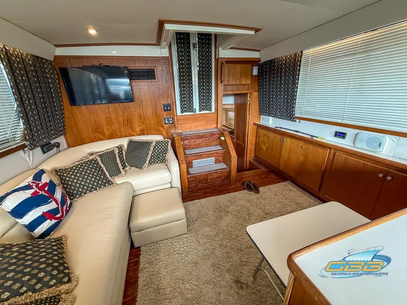 Slide: The Image of Interior of 1995 Carver 430 Cockpit Motor Yacht with cozy seating and modern amenities. - 25