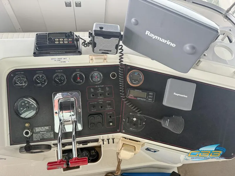 Slide: The Image of Control panel of 1995 Carver 430 Cockpit Motor Yacht with Raymarine navigation system. - 38