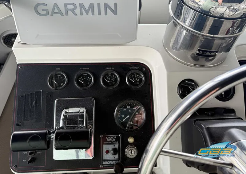 Slide: The Image of Control panel of a 1995 Carver 430 Cockpit Motor Yacht with Garmin navigation. - 39