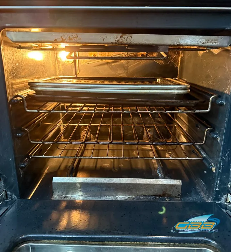 Slide: The Image of Baking tray inside an illuminated oven, showcasing cooking process. - 42