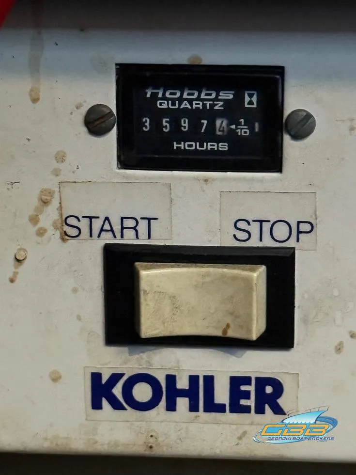Slide: The Image of Hour meter on 1995 Carver 430 Cockpit Motor Yacht, showing 3597.4 hours, with Kohler branding. - 45