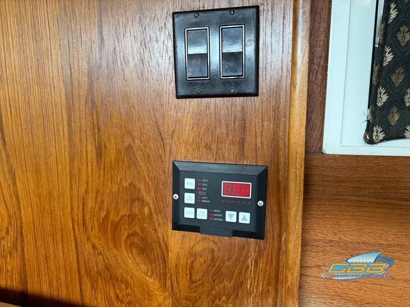 Slide: The Image of Control panel on 1995 Carver 430 Cockpit Motor Yacht's wooden interior wall. - 48