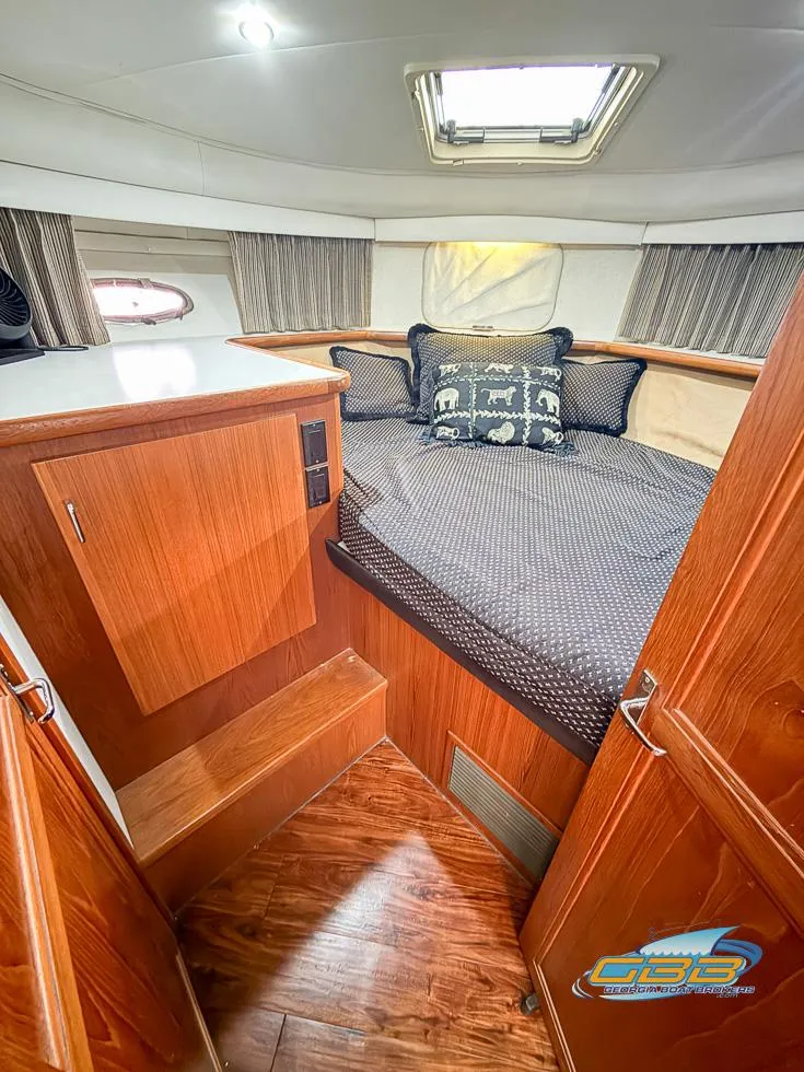 Slide: The Image of Interior of 1995 Carver 430 Cockpit Motor Yacht with cozy cabin and wood finish. - 5