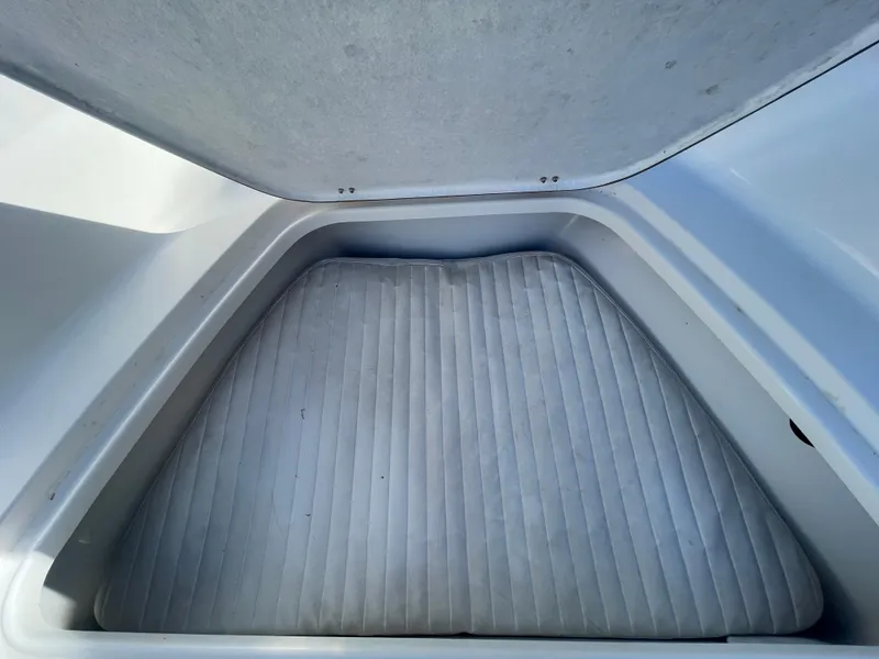 Slide: The Image of Interior view of 2007 Tidewater 216 CC Adventure boat's cushioned storage compartment. - 13
