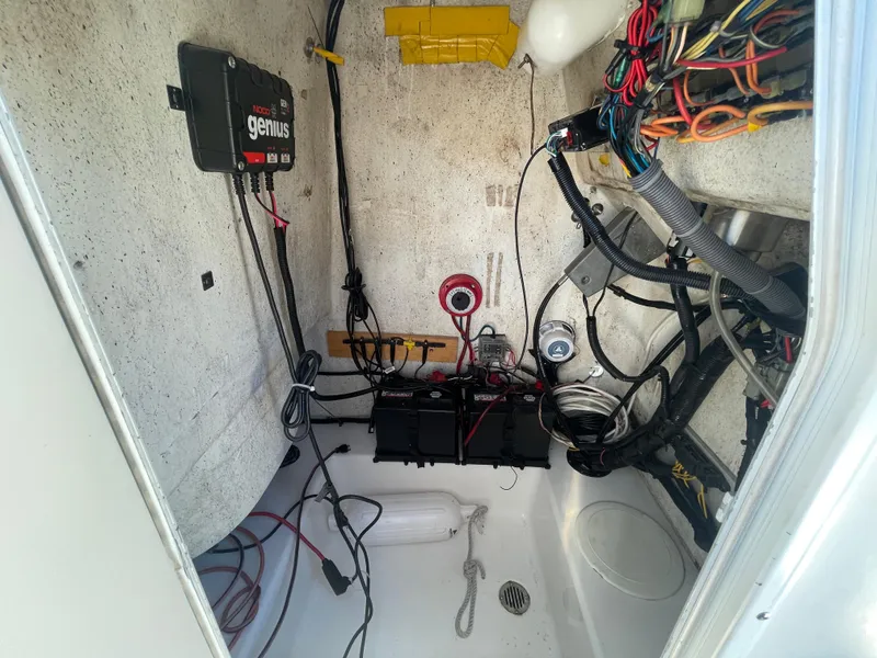 Slide: The Image of Interior wiring and battery setup of a 2007 Tidewater 216 CC Adventure boat. - 16