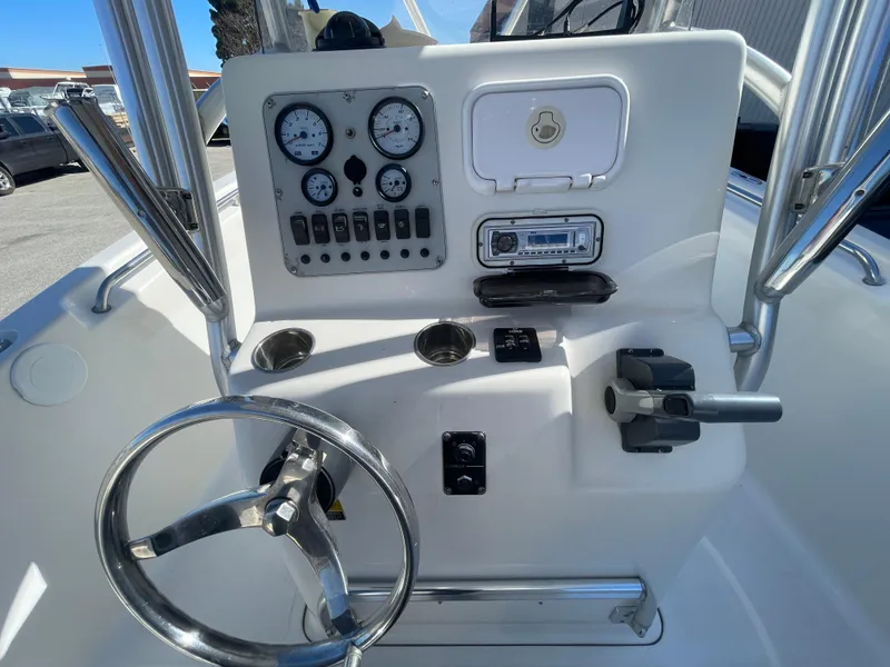 Slide: The Image of Center console of 2007 Tidewater 216 CC Adventure boat with steering wheel and gauges. - 17