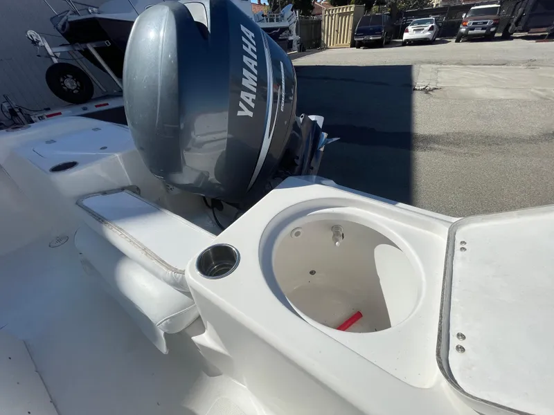 Slide: The Image of 2007 Tidewater 216 CC Adventure boat with Yamaha outboard motor, featuring a white interior. - 18