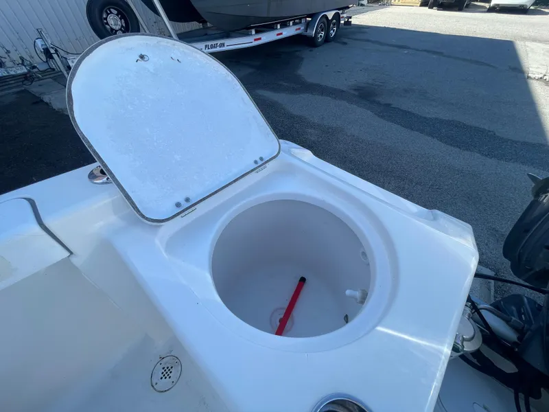 Slide: The Image of Open storage compartment on 2007 Tidewater 216 CC Adventure boat. - 19
