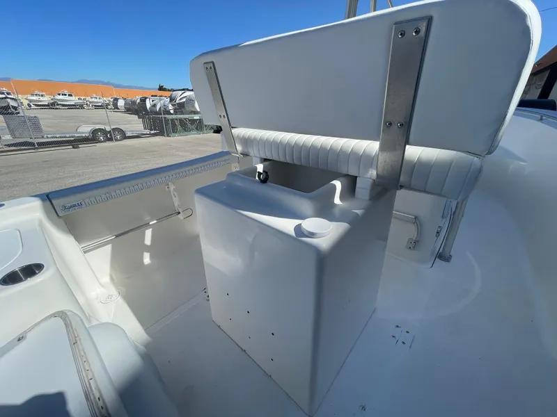 Slide: The Image of 2007 Tidewater 216 CC Adventure boat interior with seating and storage. - 20