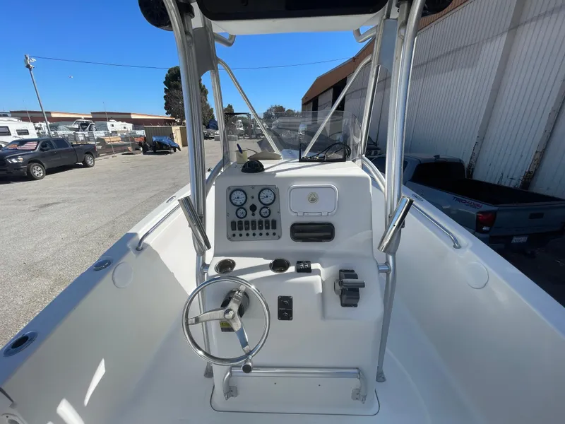 Slide: The Image of 2007 Tidewater 216 CC Adventure boat console with steering wheel and gauges. - 24