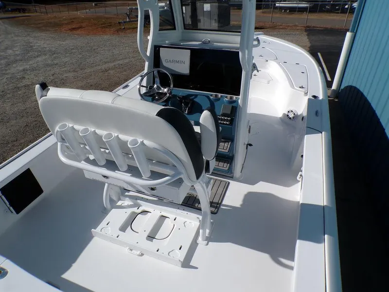 Slide: The Image of 2025 Tidewater 2410 BM boat interior with helm, seating, and navigation equipment. - 10