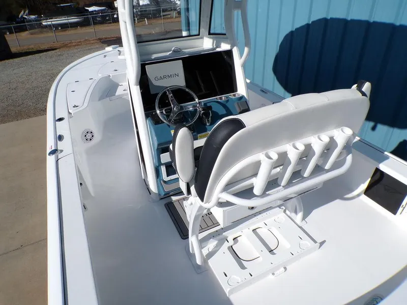 Slide: The Image of 2025 Tidewater 2410 BM boat interior with Garmin navigation system and seating. - 11