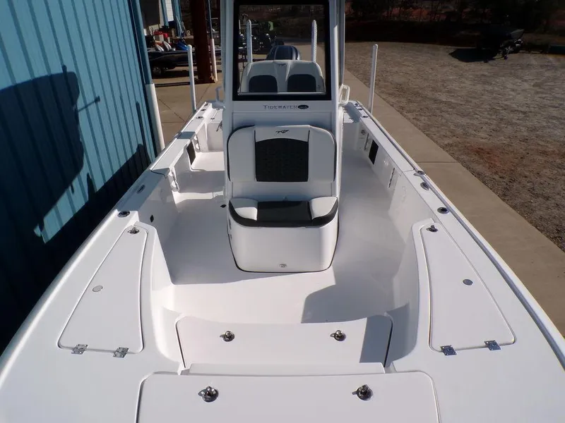 Slide: The Image of 2025 Tidewater 2410 BM boat, white interior, spacious deck, modern design. - 12