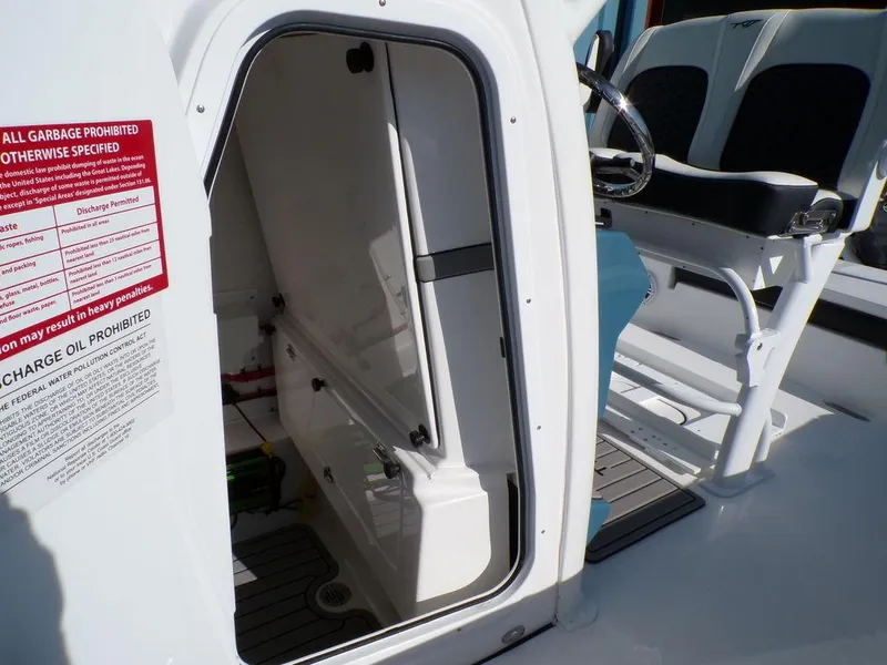 Slide: The Image of 2025 Tidewater 2410 BM boat interior with seating and storage compartment. - 22
