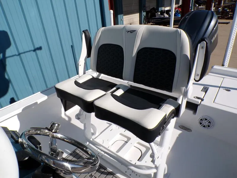 Slide: The Image of 2025 Tidewater 2410 BM boat seating and steering wheel, featuring modern design and comfort. - 23