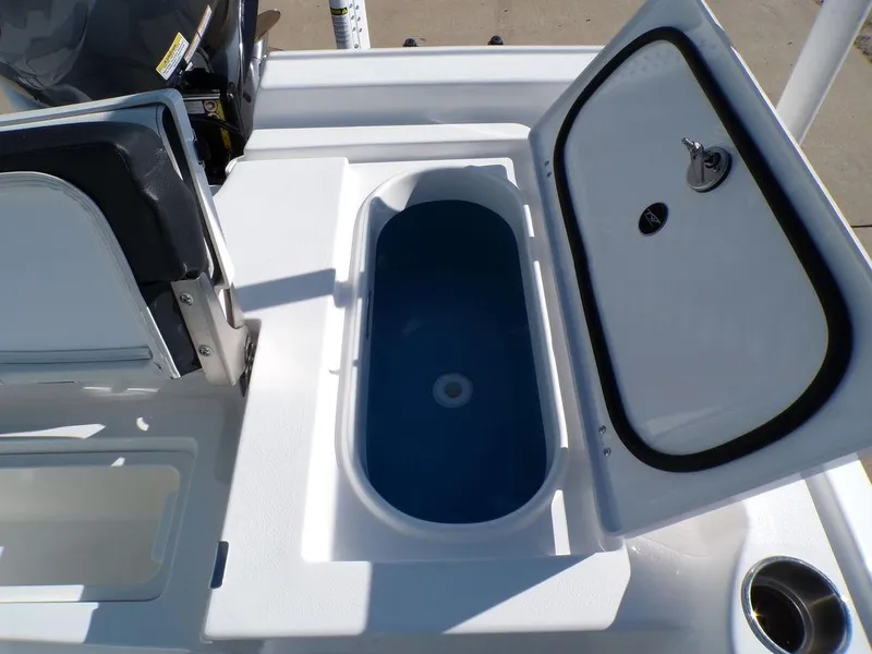 Slide: The Image of 2025 Tidewater 2410 BM boat livewell with open lid, showcasing interior design. - 27
