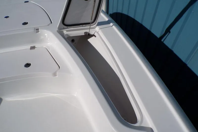 Slide: The Image of 2025 Tidewater 2410 Bay Max boat storage compartments, open and closed, showcasing sleek design. - 31