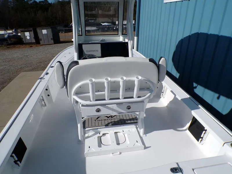 Slide: The Image of 2025 Tidewater 2410 BM boat interior with white seating and console. - 9