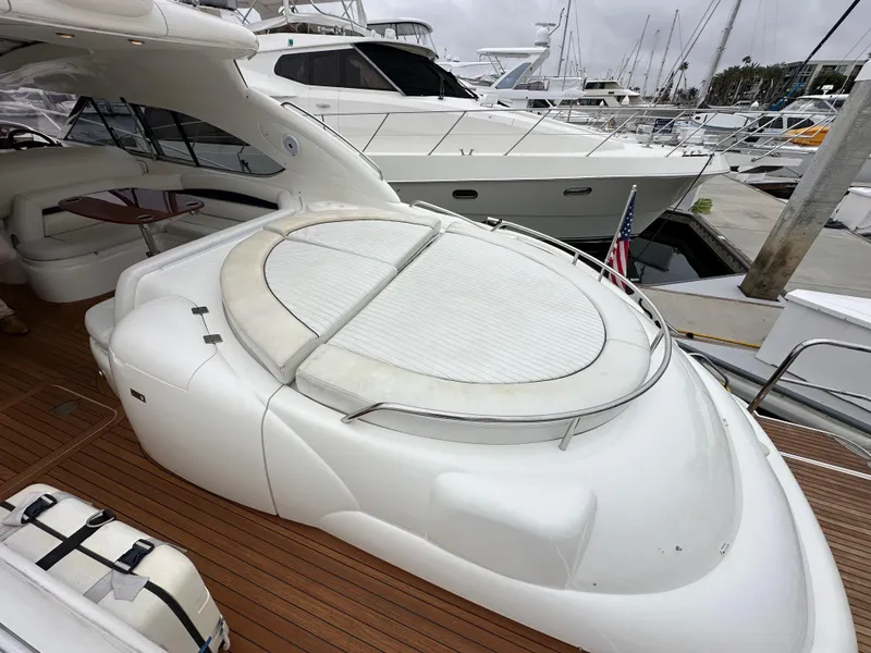 Slide: The Image of Sunseeker Predator 60 yacht, 2000 model, featuring sleek design and spacious deck area. - 13