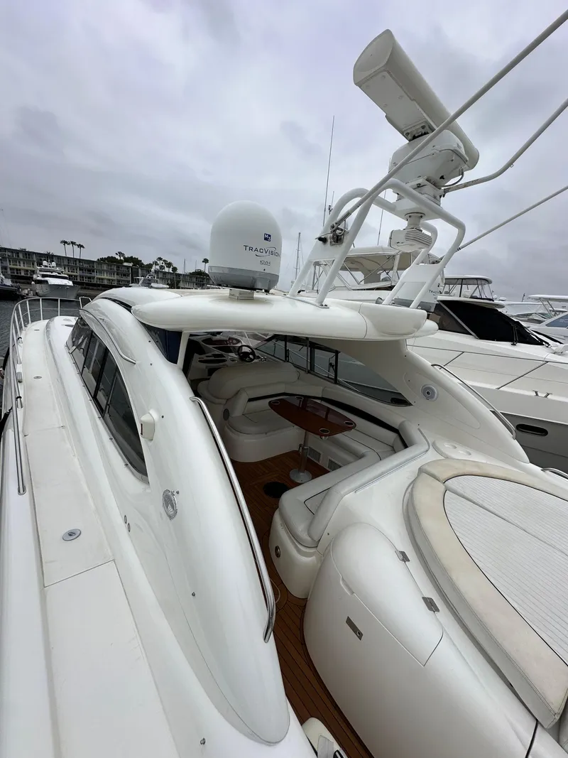 Slide: The Image of Sunseeker Predator 60 yacht, 2000 model, featuring sleek design and spacious deck area. - 14