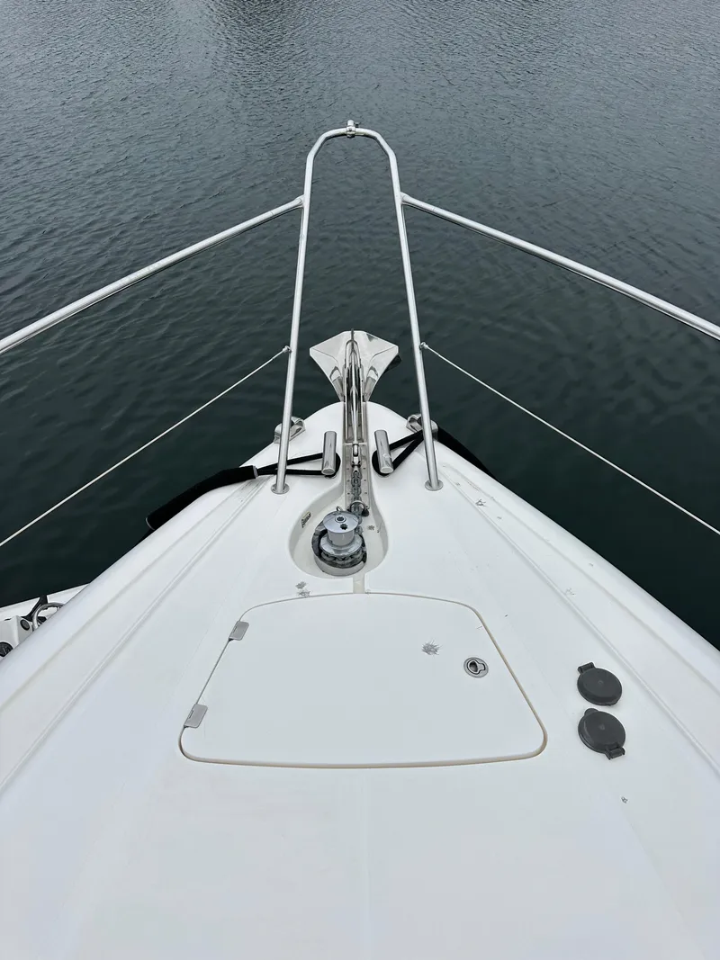 Slide: The Image of Bow view of 2000 Sunseeker Predator 60 yacht on calm water. - 20