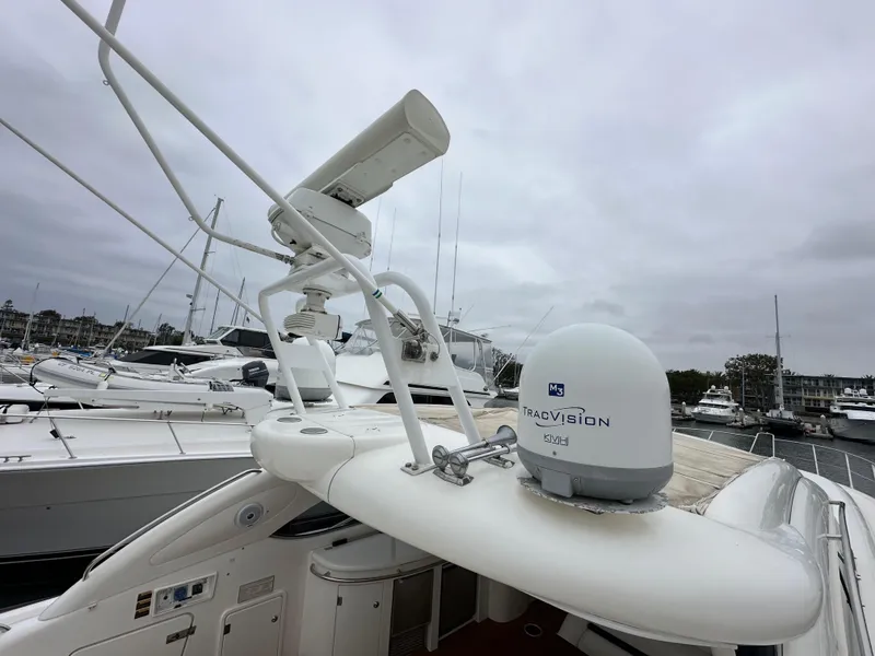 Slide: The Image of Sunseeker Predator 60 yacht, 2000 model, docked with radar and navigation equipment visible. - 27