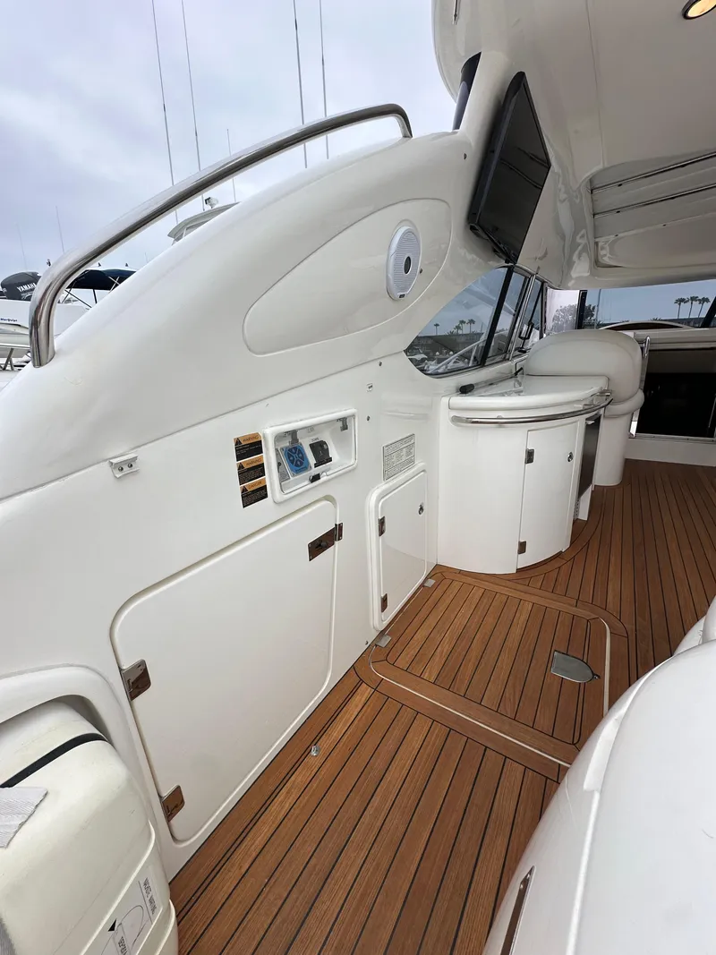 Slide: The Image of 2000 Sunseeker Predator 60 yacht interior with sleek design and wooden flooring. - 30