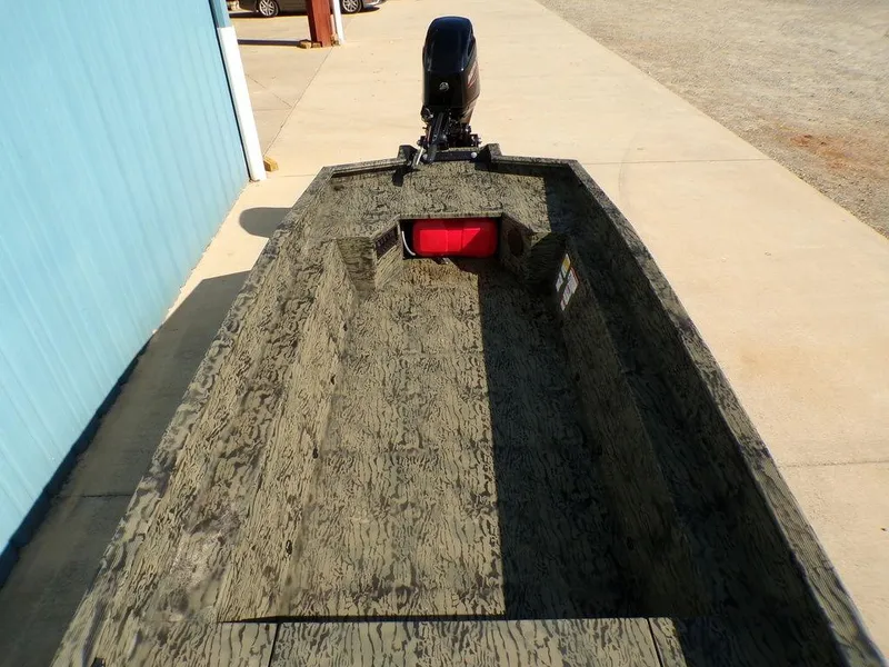 Slide: The Image of 2025 Tracker Grizzly® 1650 T Prairie Wings Edition boat, camo design, parked outdoors. - 10
